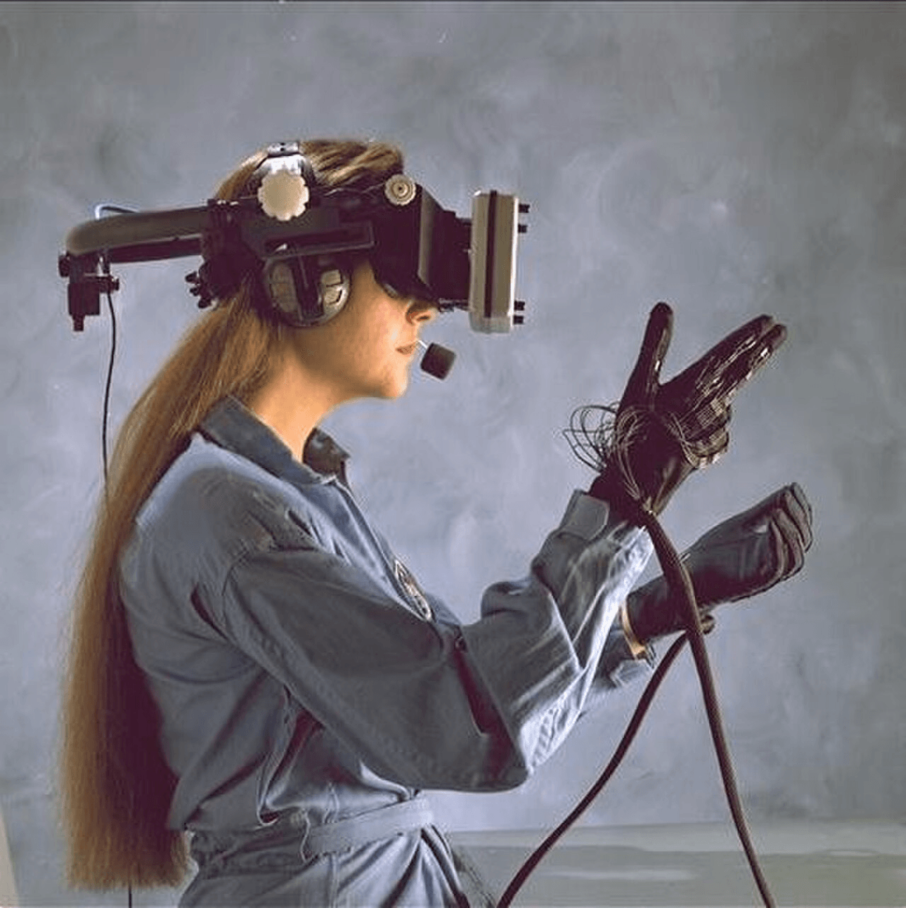 Operator wearing a head-mounted multimodal capture rig in a research setting